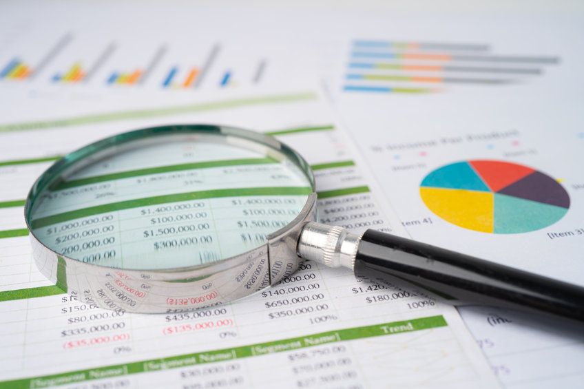 Magnifying glass on charts